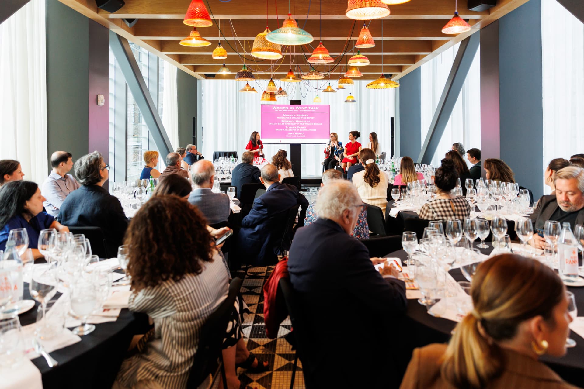 Corporate wine seminar with panelists and seated guests