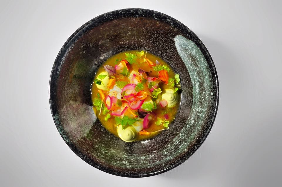 Colorful seafood composition in a dark bowl