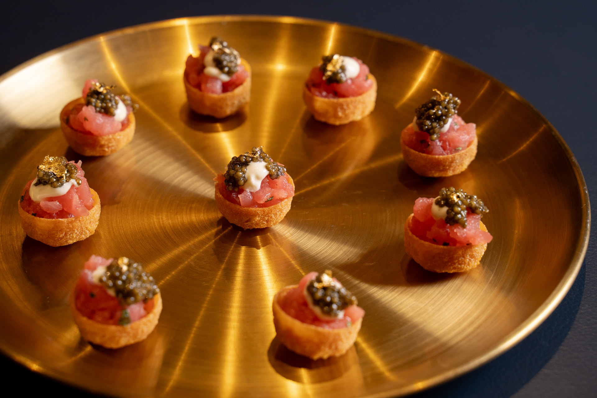 Passed Italian hors d'oeuvres on a gold tray for a cocktail reception