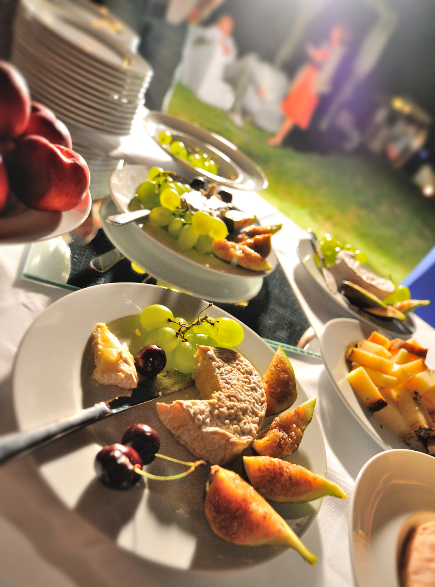 Family-style cheese and fruit display for a shared Italian celebration