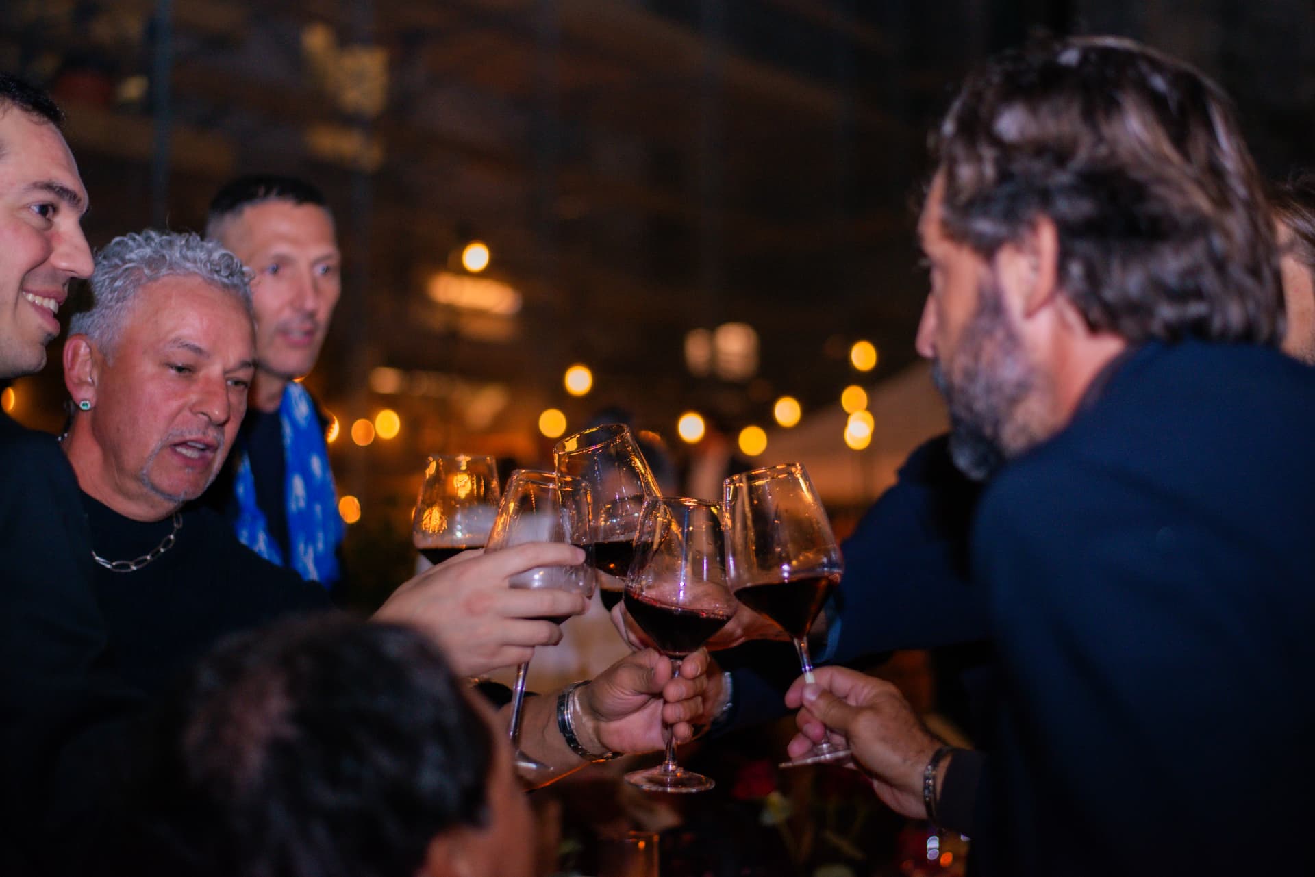 Guests toasting with wine at a corporate celebration