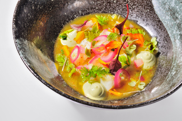 Composed dish with pickled vegetables and green sauce