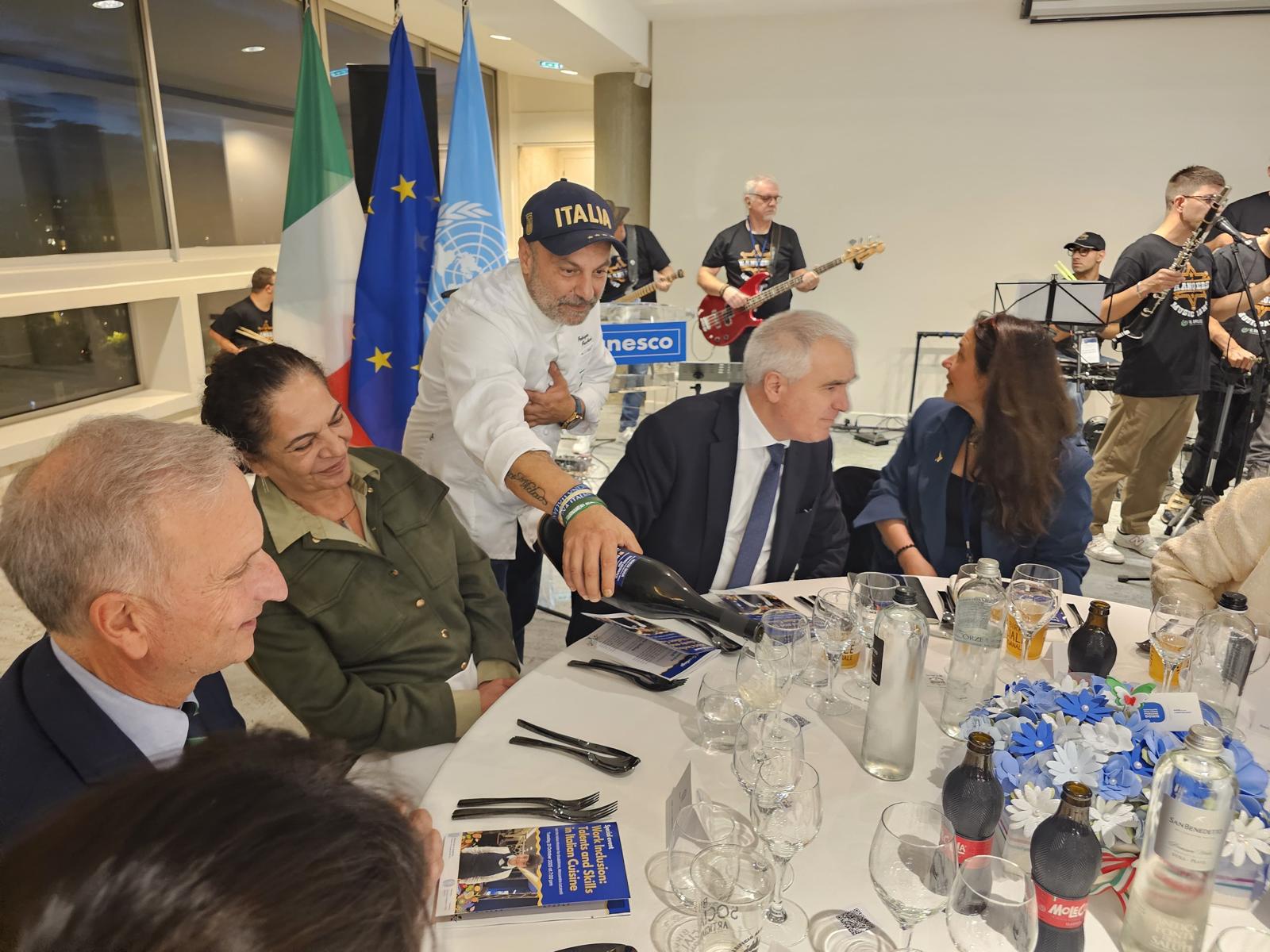 Chef Fabrizio Facchini serving guests at a UNESCO gala dinner