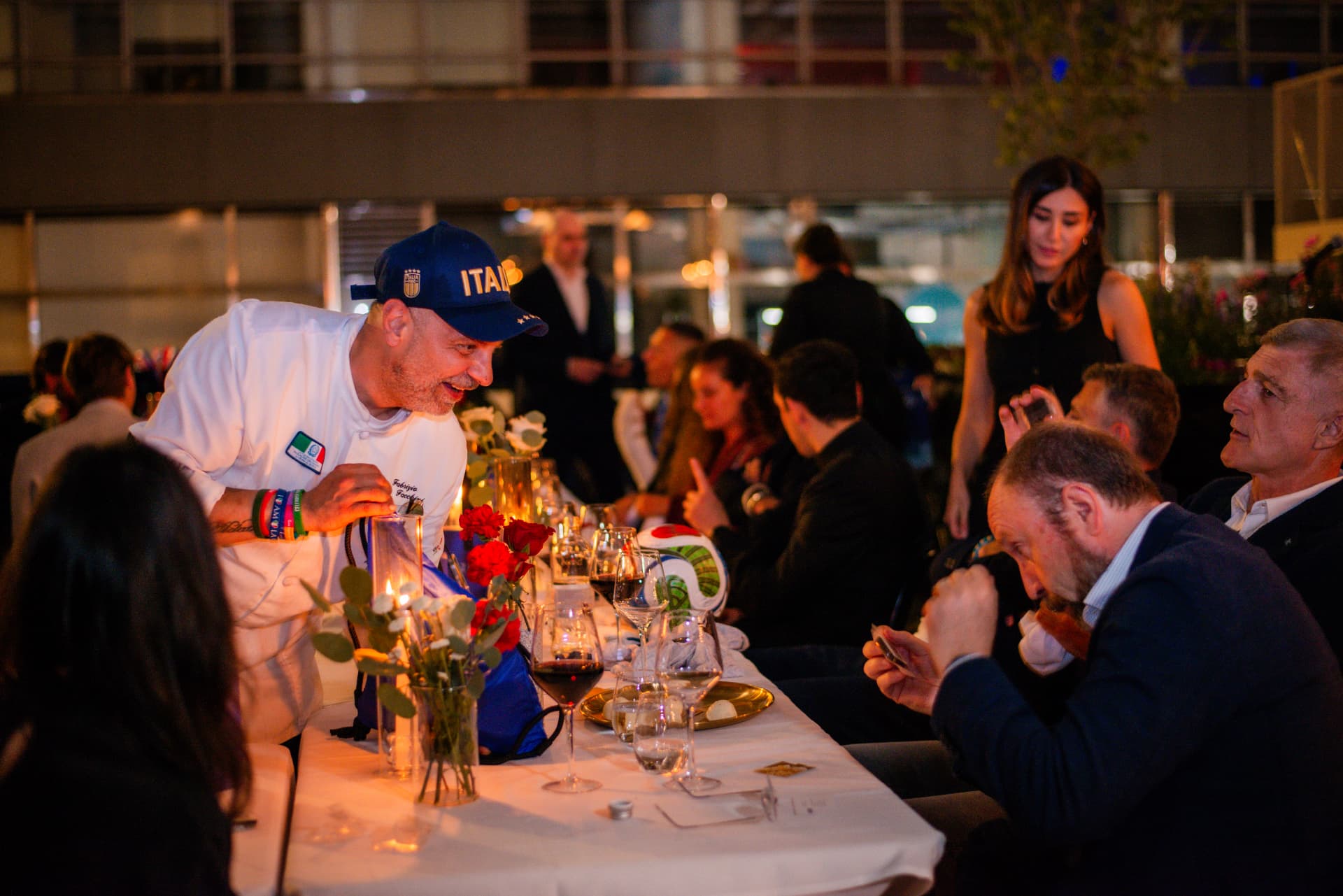 Chef Fabrizio Facchini welcoming guests at a corporate dinner
