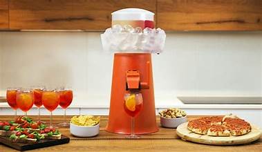 Sprizzer aperitivo machine serving Italian spritz at a party spread