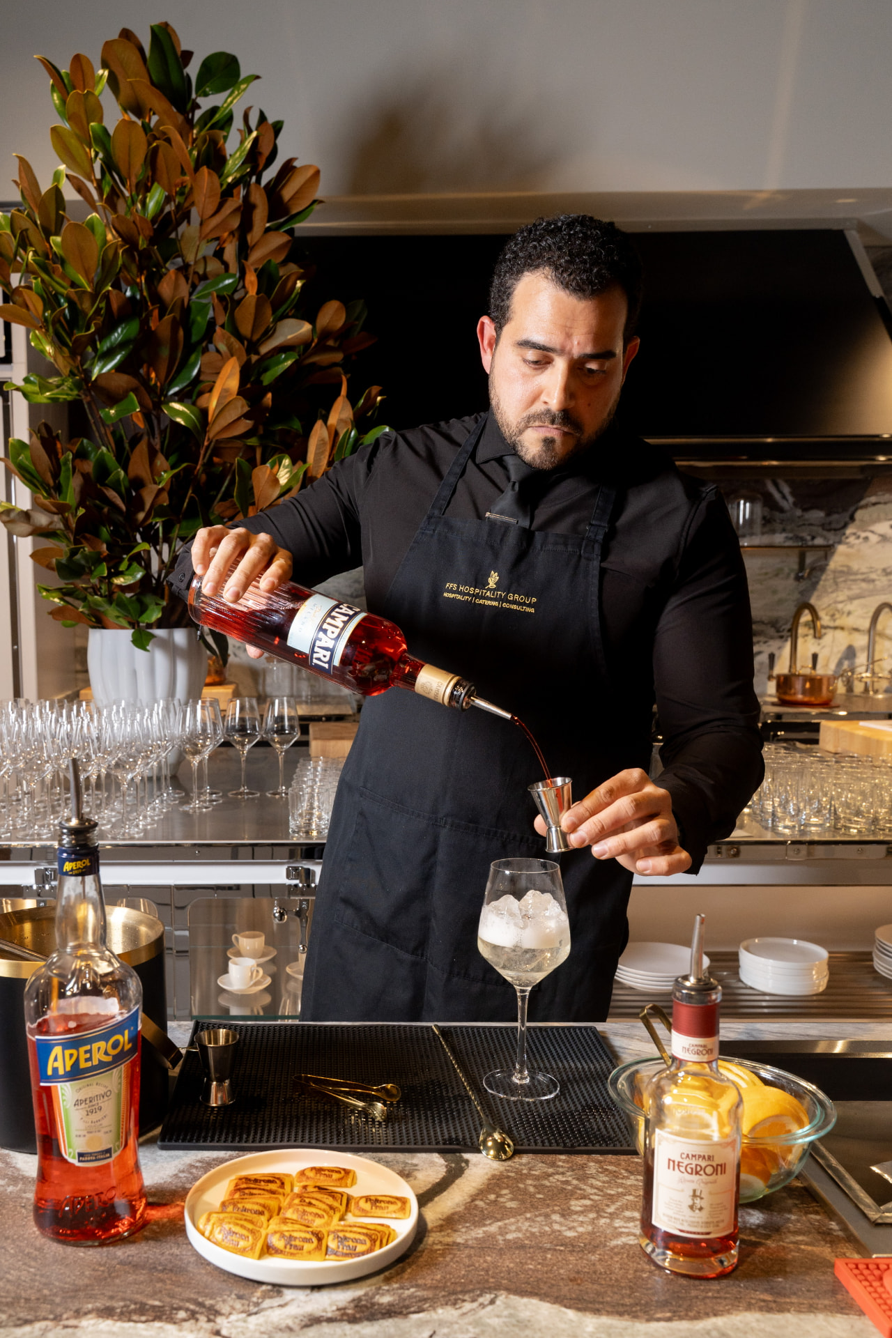 Bartender pouring Campari for an Italian cocktail experience
