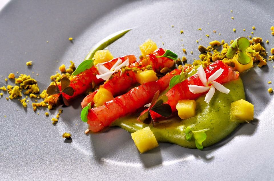 Red prawns with pineapple, green sauce and microgreens