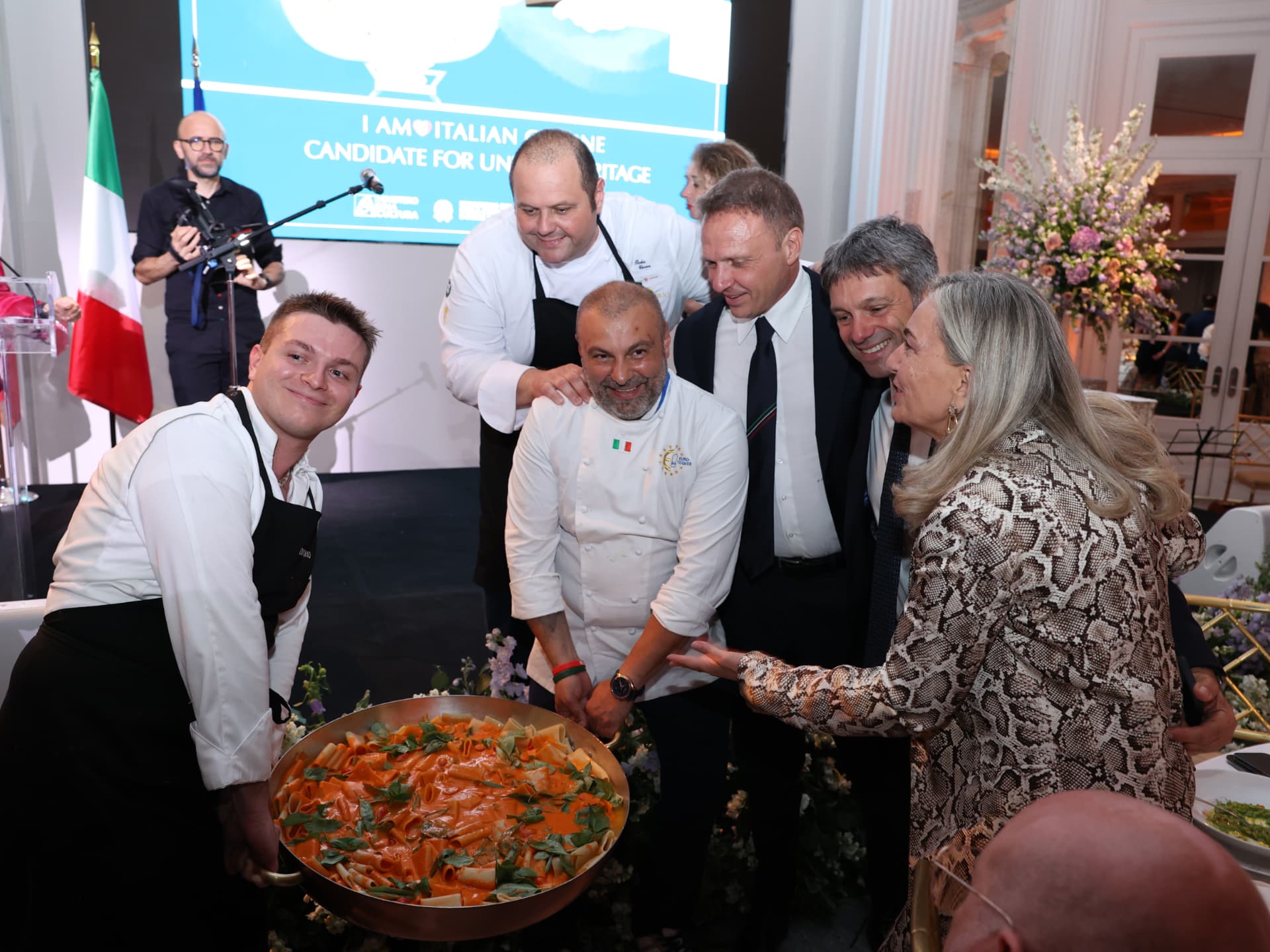 The La Dolce Vita team presenting a celebratory pasta course to guests