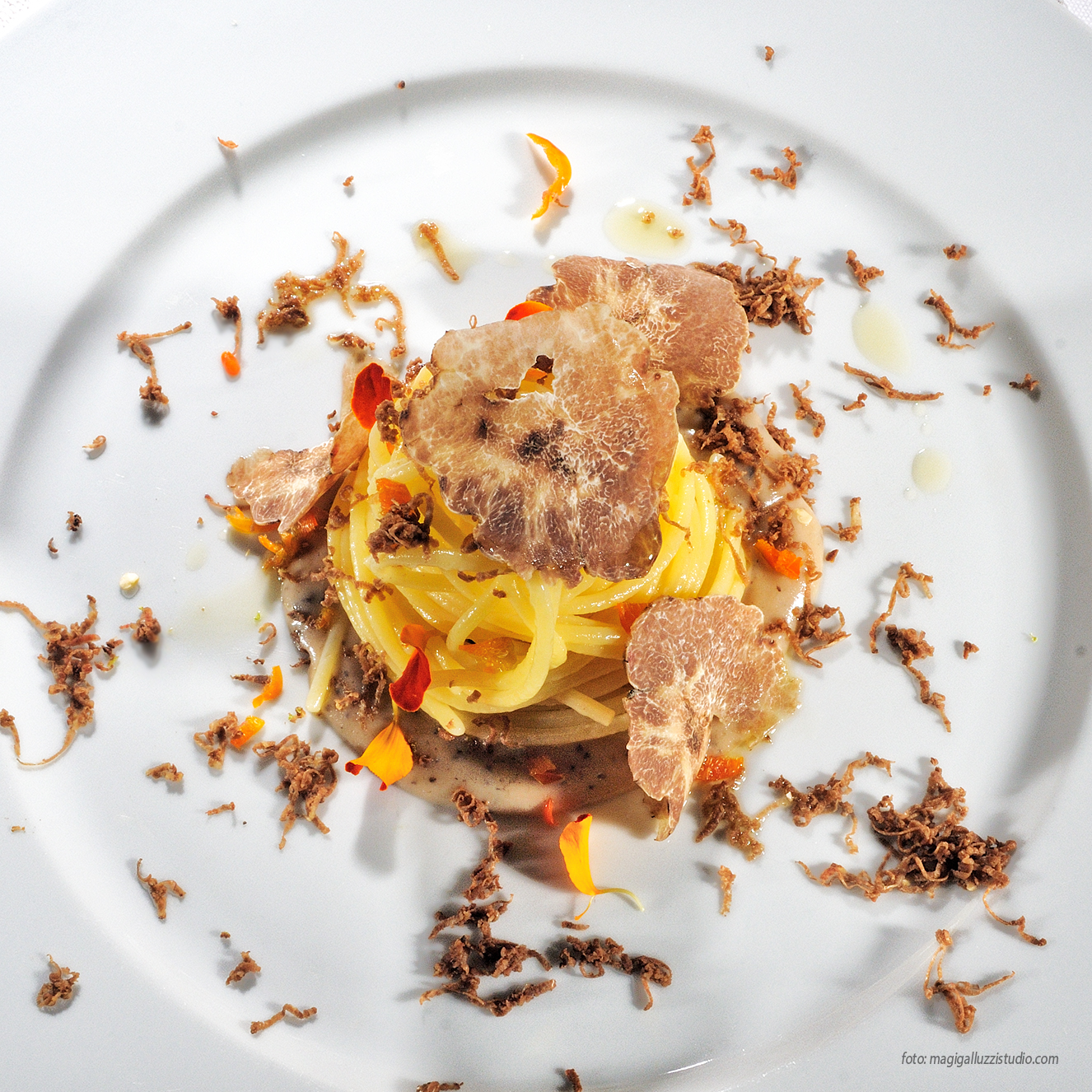 Spaghetti with shaved truffle plated for a private dinner