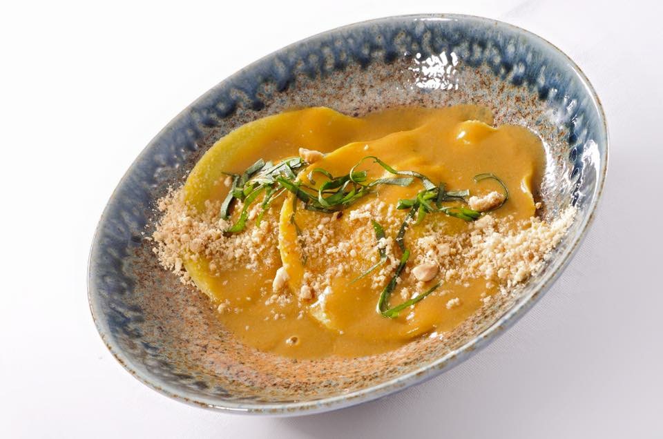 Saffron ravioli with sauce and toasted crumb topping