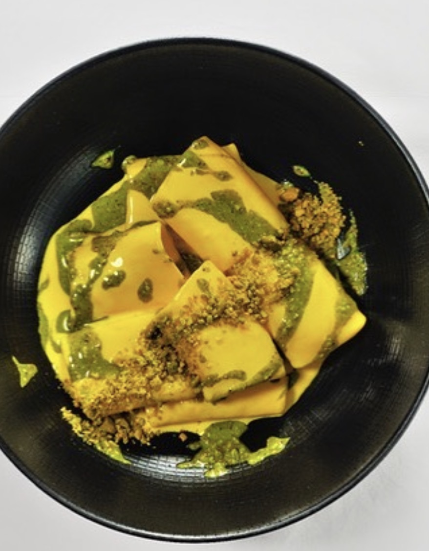 Saffron ravioli with pesto and toasted crumb topping