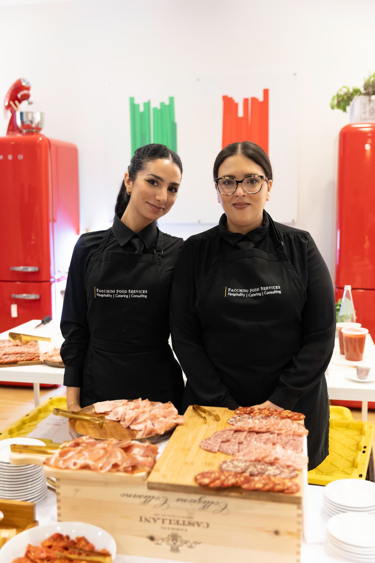 Facchini Food Services staff behind an Italian charcuterie display
